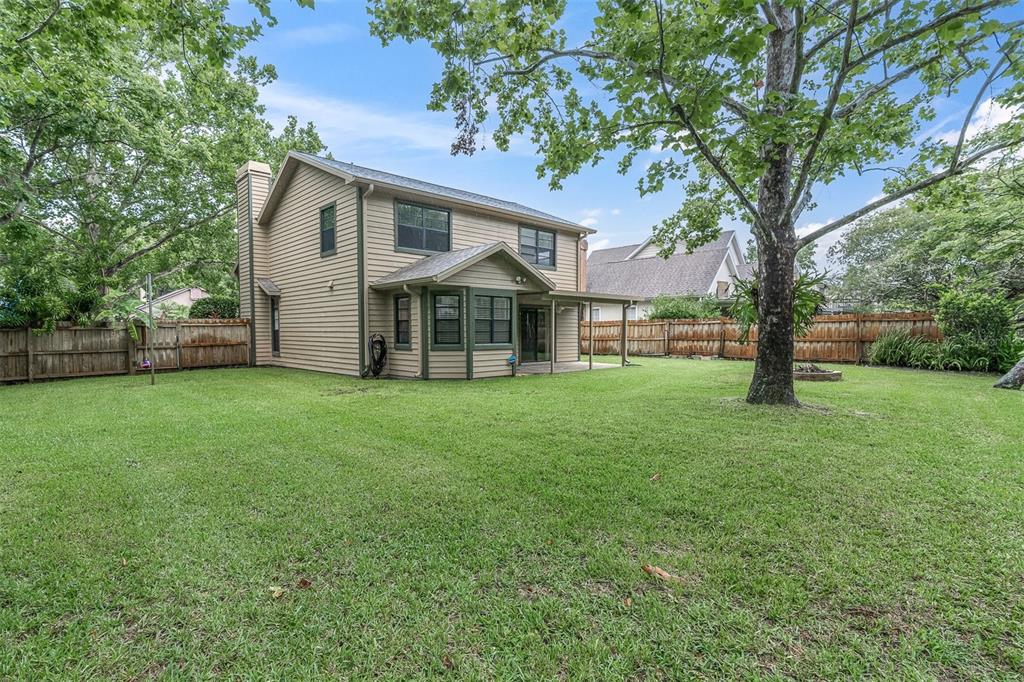 7230 Hummingbird Lane New Port Richey, FL 34655 - Photo 38 of 41 front view of a house with a yard