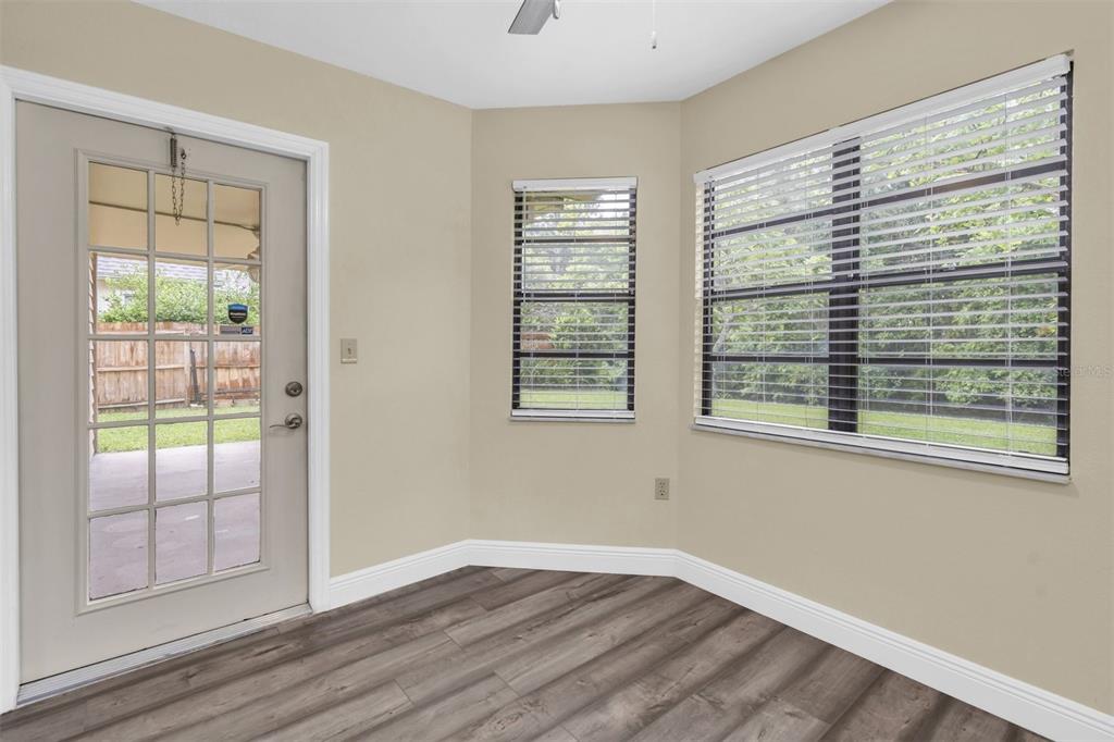 7230 Hummingbird Lane New Port Richey, FL 34655 - Photo 41 of 41 a view of an empty room with wooden floor and a window