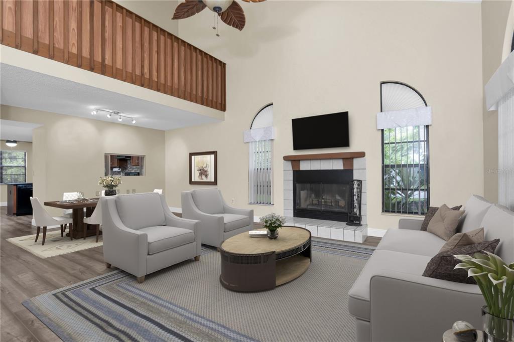 7230 Hummingbird Lane New Port Richey, FL 34655 - Photo 5 of 41 a living room with furniture and a fireplace