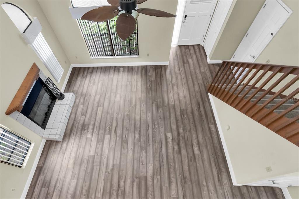 7230 Hummingbird Lane New Port Richey, FL 34655 - Photo 7 of 41 a view of wooden floor in a hall with wooden floor