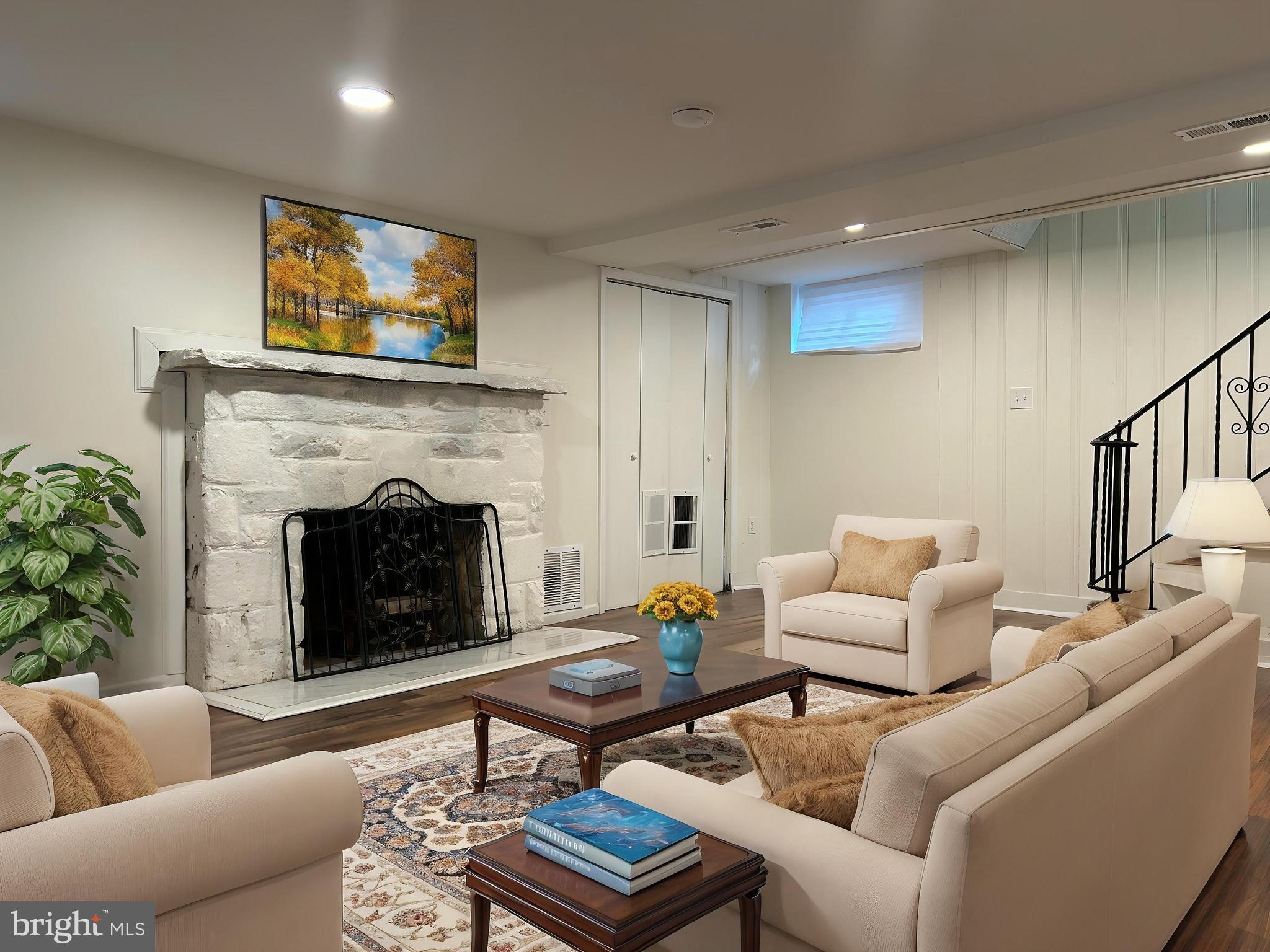 3405 Dennlyn Road Baltimore, MD 21215 - Photo 19 of 20 a living room with furniture and a fireplace