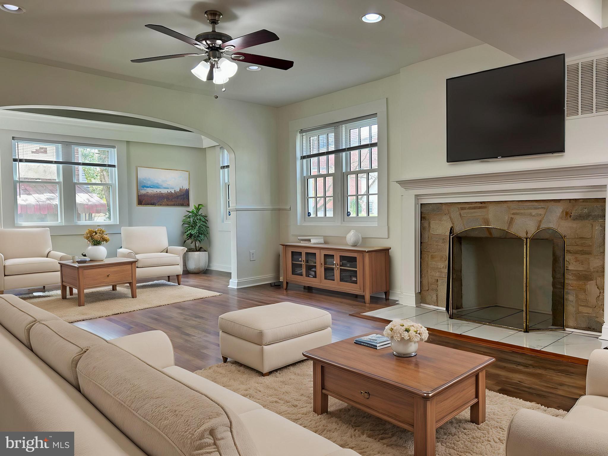 3405 Dennlyn Road Baltimore, MD 21215 - Photo 2 of 20 a living room with furniture fireplace and flat screen tv