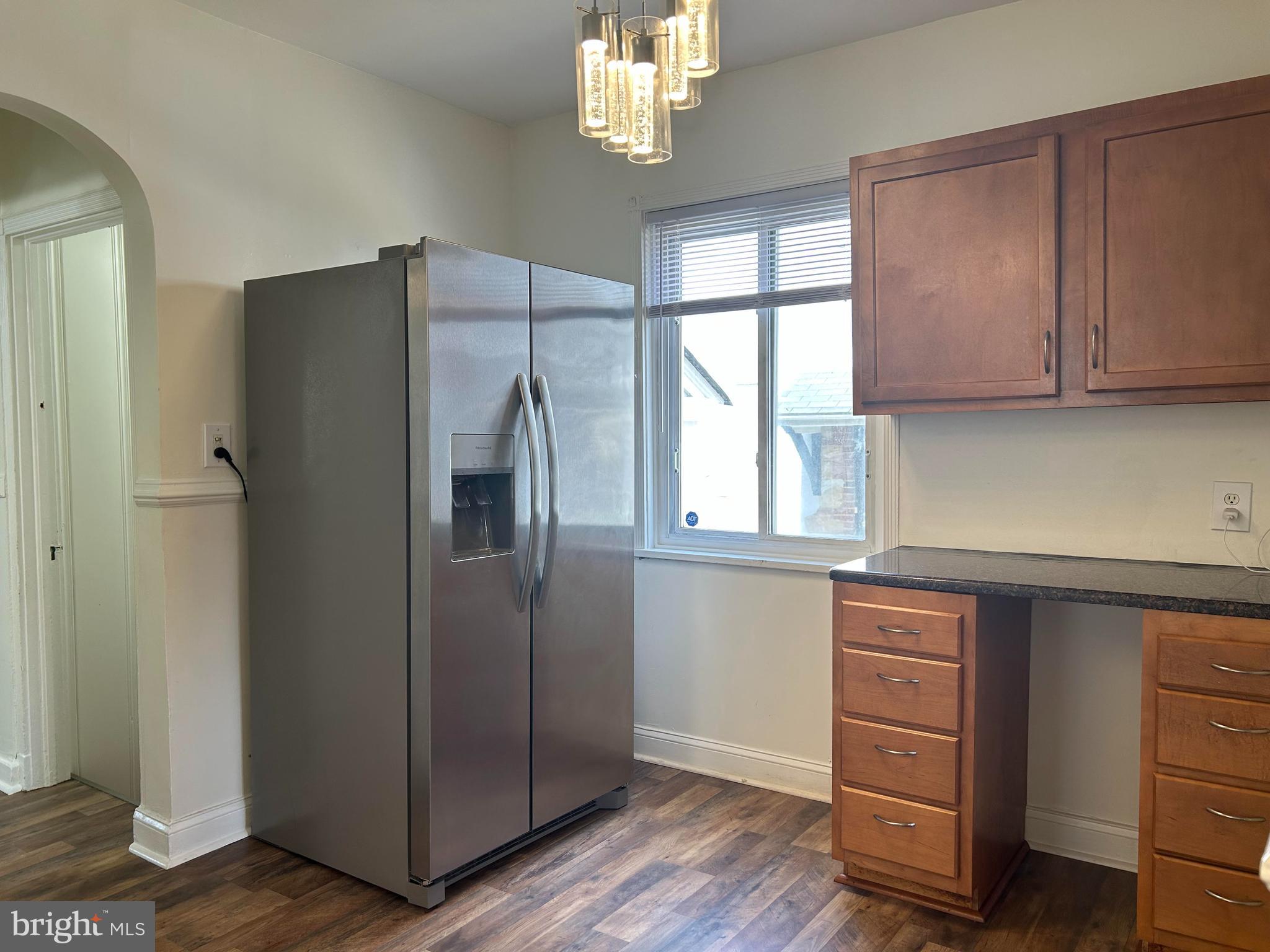 3405 Dennlyn Road Baltimore, MD 21215 - Photo 4 of 20 a kitchen with a refrigerator and window