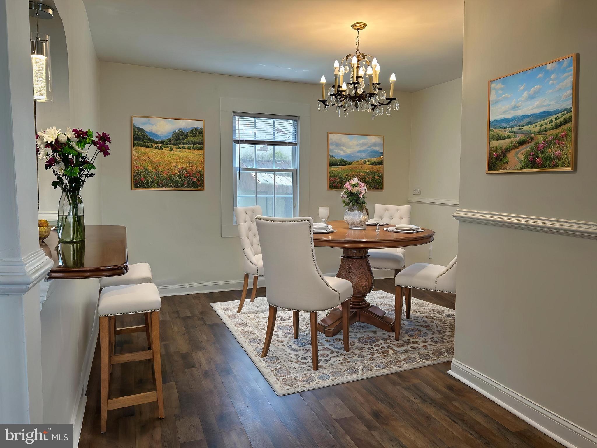 3405 Dennlyn Road Baltimore, MD 21215 - Photo 6 of 20 a view of a dining room with furniture and chandelier