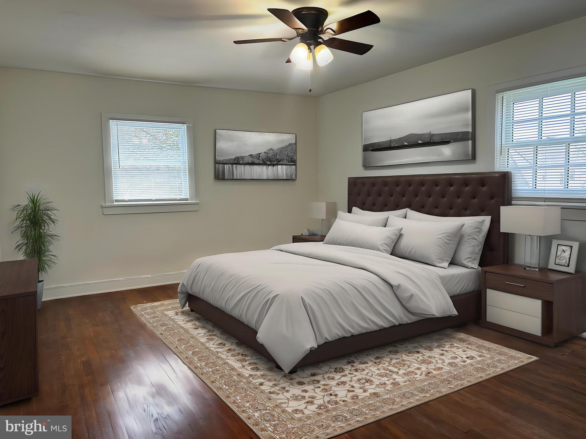 3405 Dennlyn Road Baltimore, MD 21215 - Photo 8 of 20 a bedroom with a large bed and a window