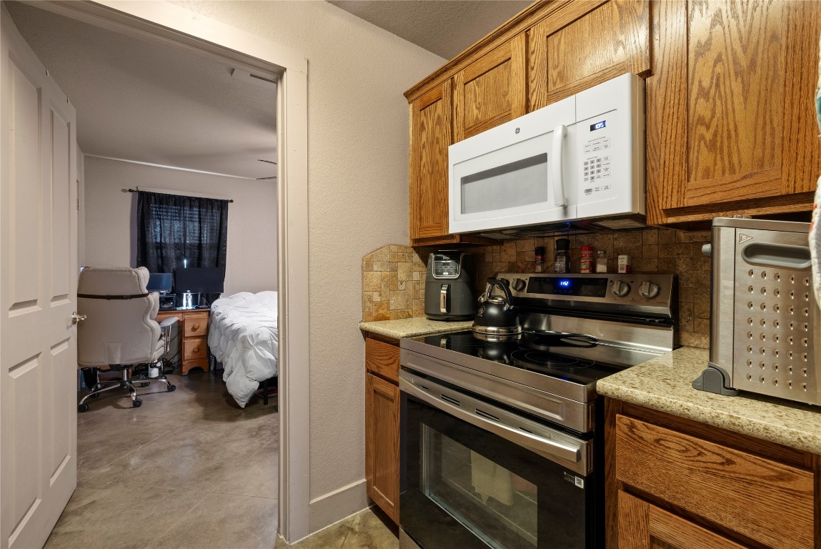 1239 Honor Lane Temple, TX 76501 - Photo 9 of 21 a kitchen with a stove and a microwave
