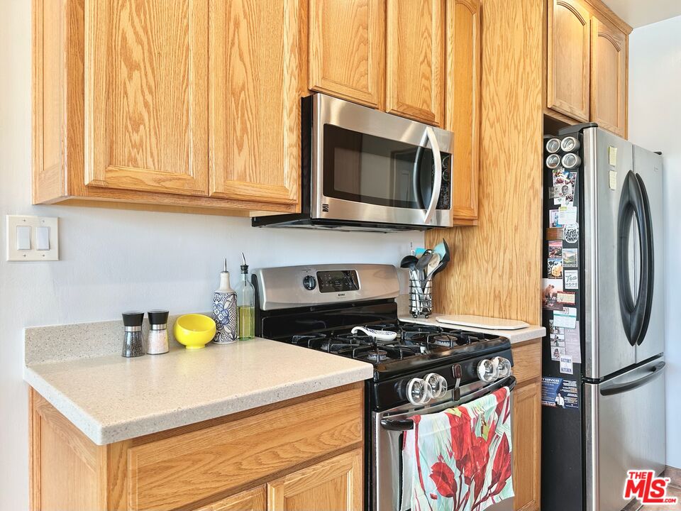 2132 Mcpherson Place Los Angeles, CA 90032 - Photo 11 of 28 a kitchen with a stove and a microwave