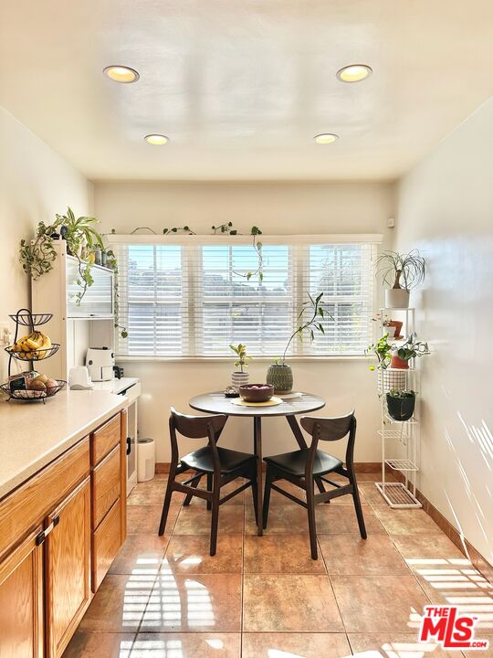 2132 Mcpherson Place Los Angeles, CA 90032 - Photo 13 of 28 a kitchen with a sink and chairs