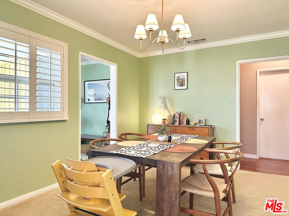 2132 Mcpherson Place Los Angeles, CA 90032 - Photo 14 of 28 a view of a dining room with furniture and chandelier