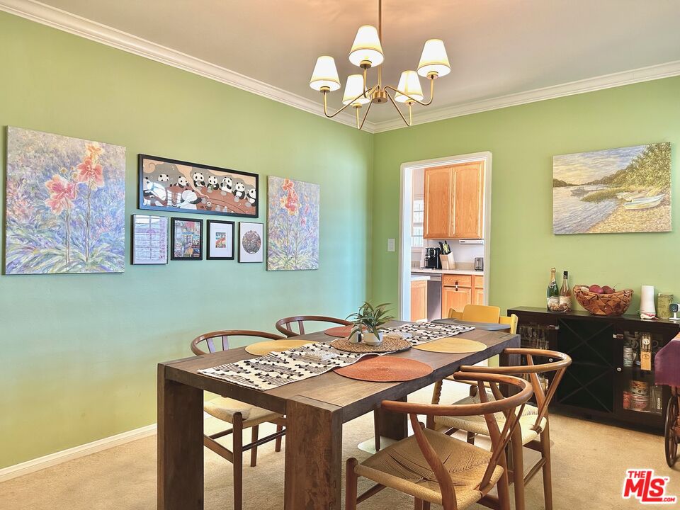 2132 Mcpherson Place Los Angeles, CA 90032 - Photo 15 of 28 a view of a dining room with furniture and chandelier