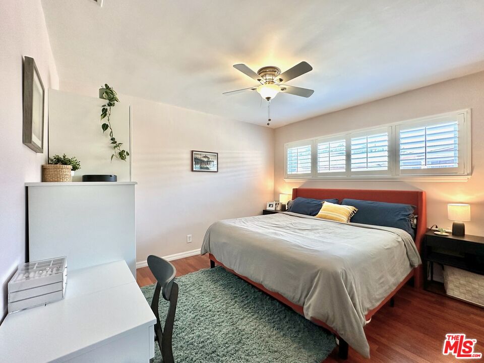 2132 Mcpherson Place Los Angeles, CA 90032 - Photo 16 of 28 a bedroom with a bed chandelier and a window