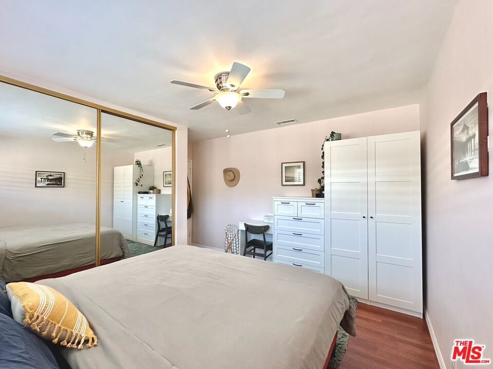 2132 Mcpherson Place Los Angeles, CA 90032 - Photo 17 of 28 a bedroom with a bed and a chandelier