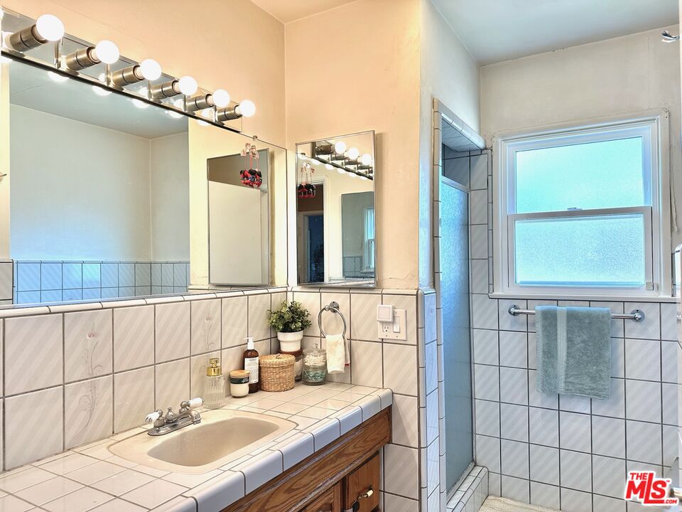2132 Mcpherson Place Los Angeles, CA 90032 - Photo 18 of 28 a bathroom with a sink and a mirror