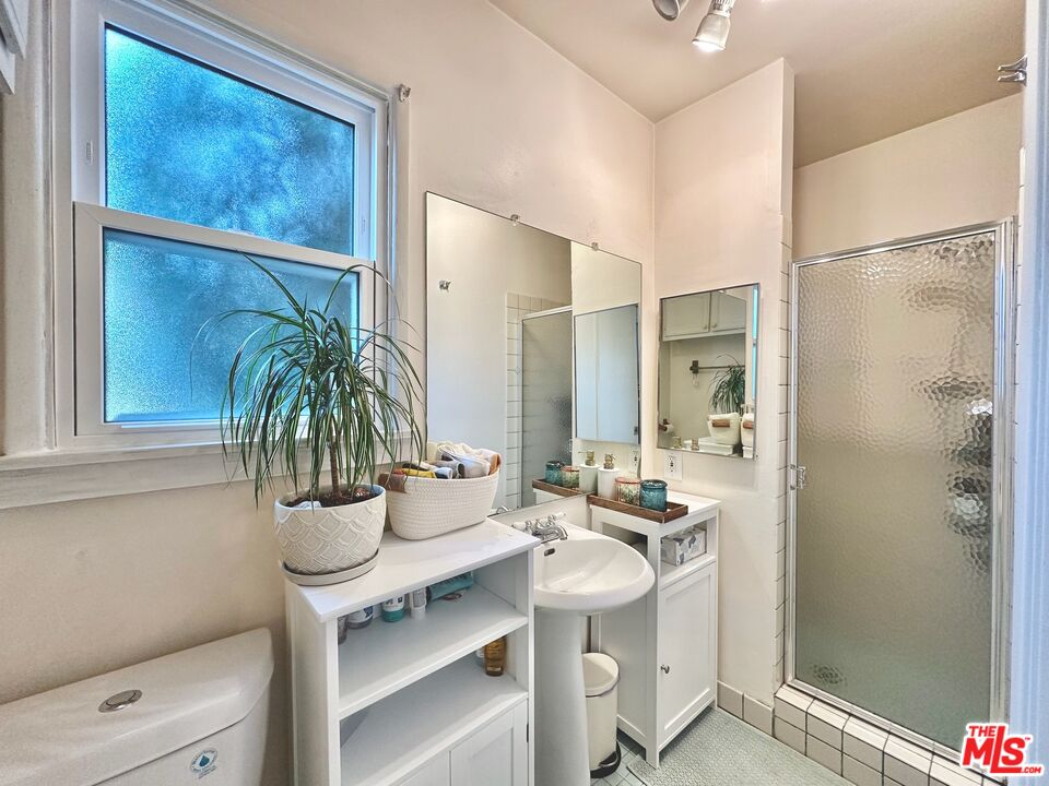 2132 Mcpherson Place Los Angeles, CA 90032 - Photo 24 of 28 a bathroom with a sink and a mirror