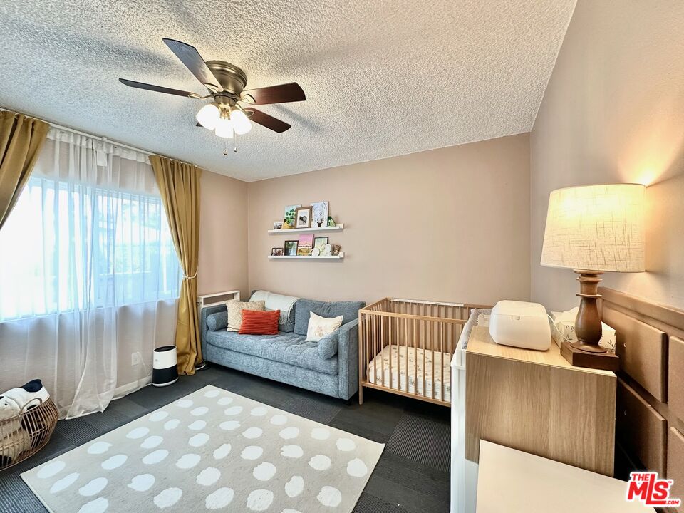 2132 Mcpherson Place Los Angeles, CA 90032 - Photo 25 of 28 a bedroom with a bed and a window
