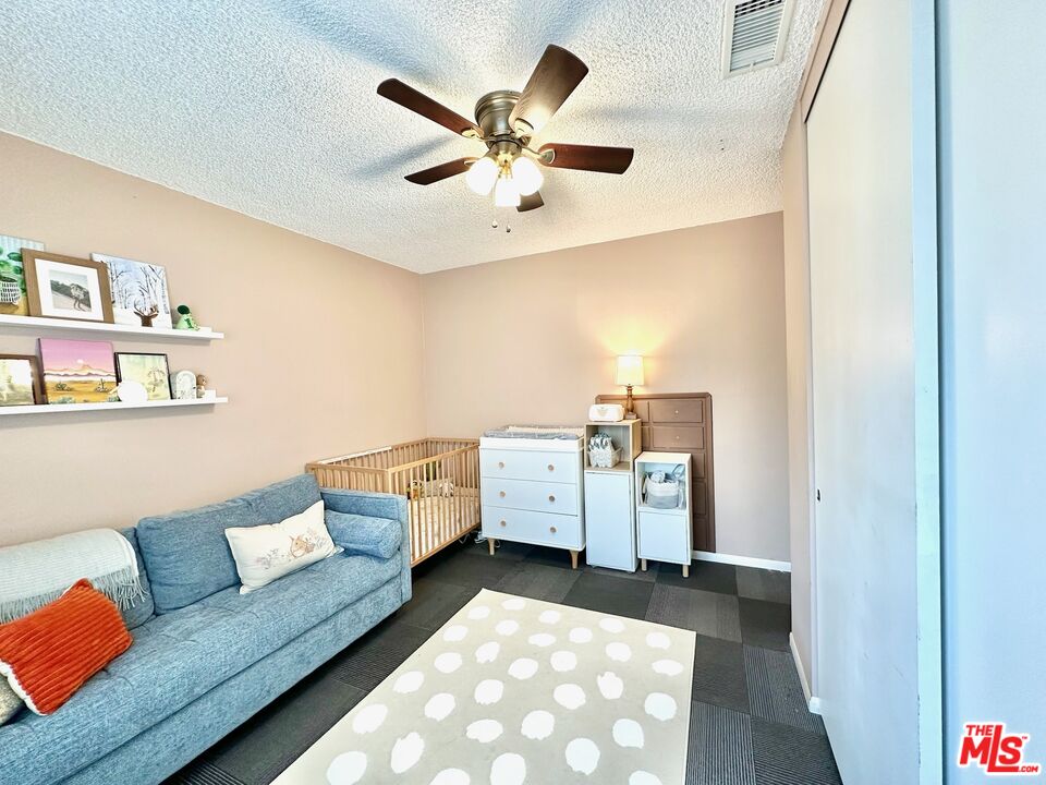 2132 Mcpherson Place Los Angeles, CA 90032 - Photo 26 of 28 a living room with furniture and white walls