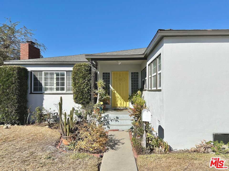 2132 Mcpherson Place Los Angeles, CA 90032 - Photo 28 of 28 a front view of a house with garden