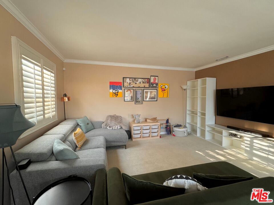 2132 Mcpherson Place Los Angeles, CA 90032 - Photo 6 of 28 a living room with furniture and a flat screen tv