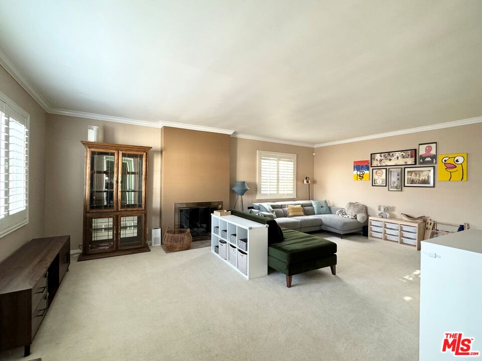 2132 Mcpherson Place Los Angeles, CA 90032 - Photo 8 of 28 a living room with furniture and a window