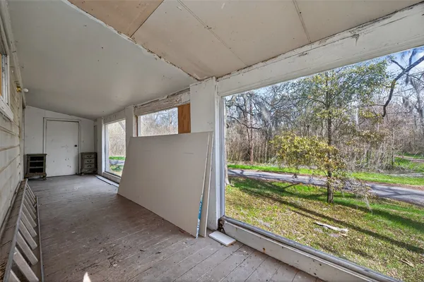a view of a porch and garden