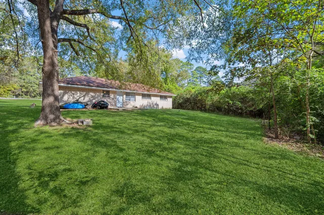 a view of a house with a big yard