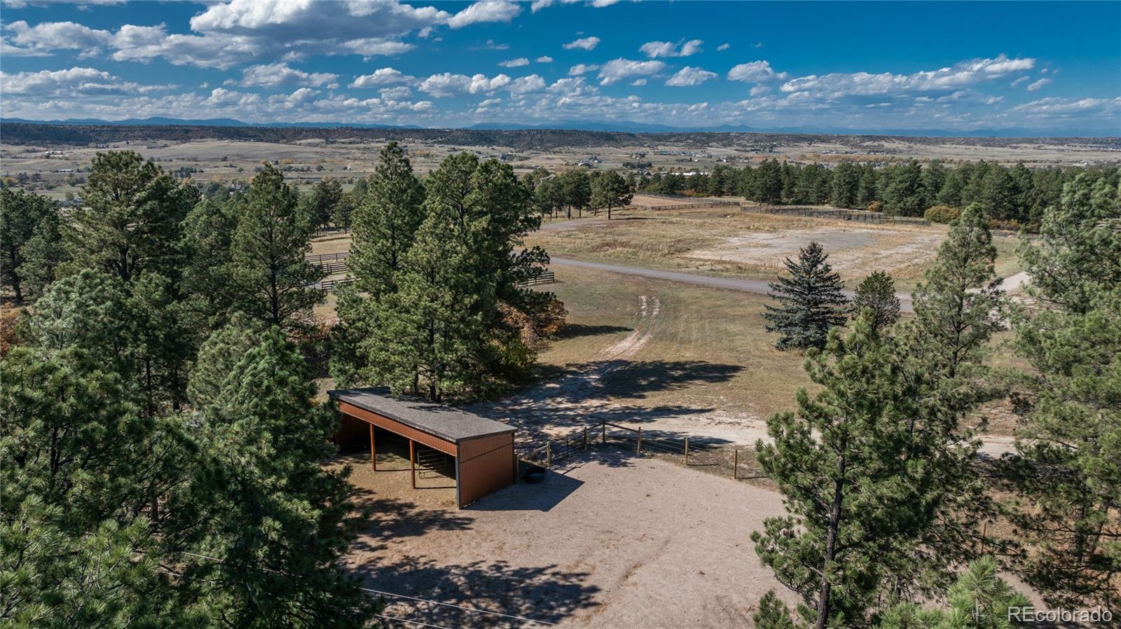 854 Russellville Road Franktown, CO 80116 - Photo 11 of 35 a view of a yard with an outdoor space
