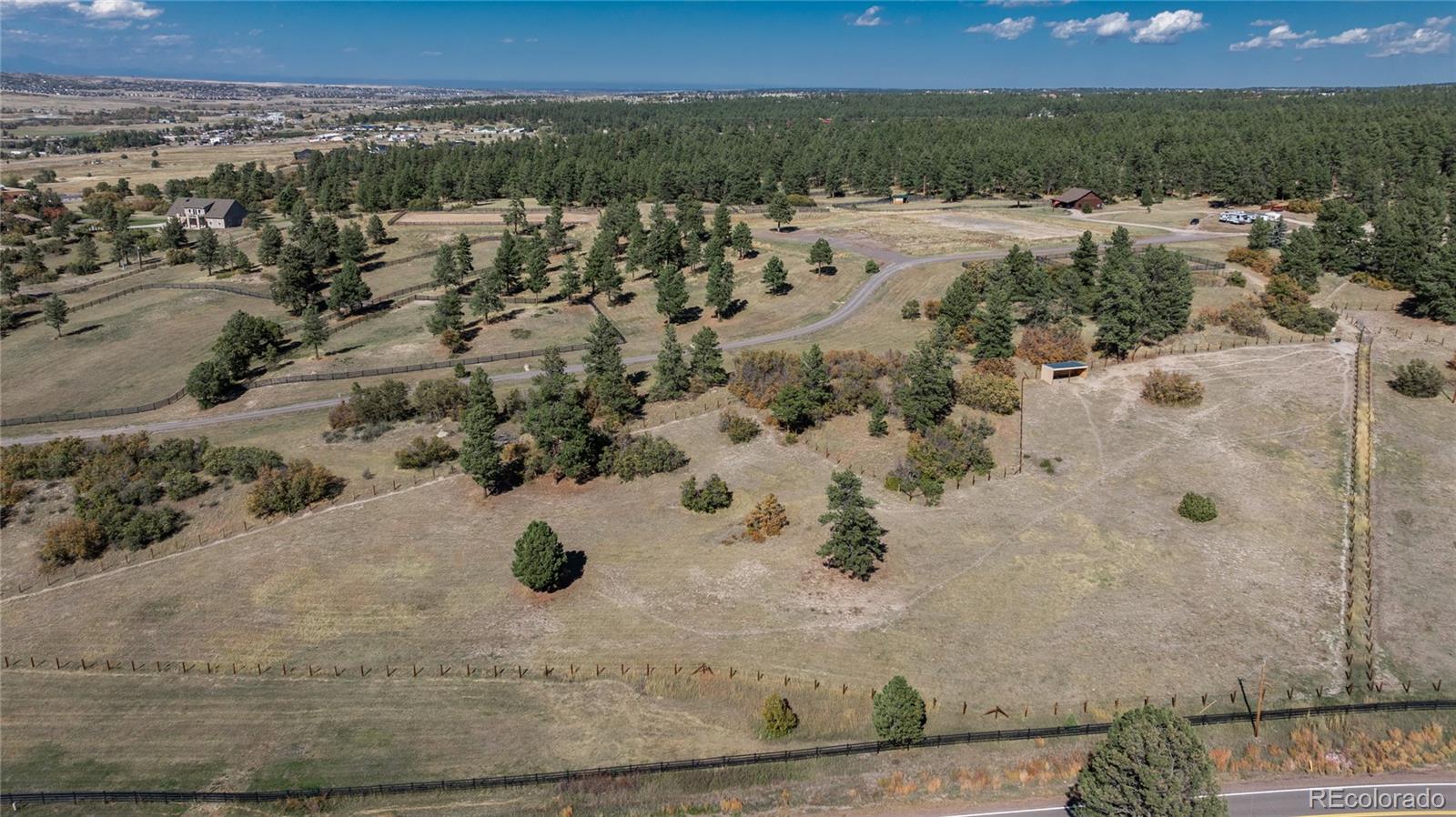 854 Russellville Road Franktown, CO 80116 - Photo 15 of 35 an aerial view of a house with a yard