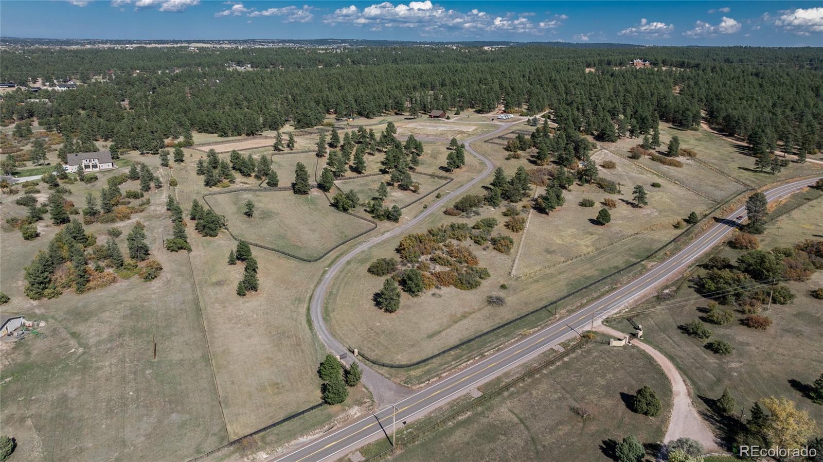 854 Russellville Road Franktown, CO 80116 - Photo 17 of 35 an aerial view of a house with a yard