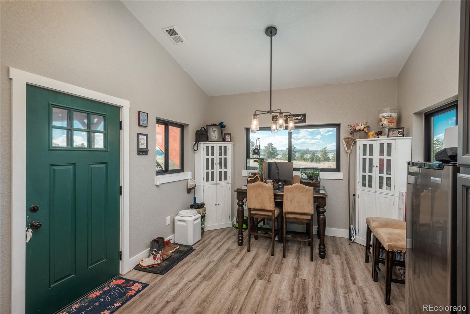 854 Russellville Road Franktown, CO 80116 - Photo 21 of 35 a view of a workspace with furniture and windows
