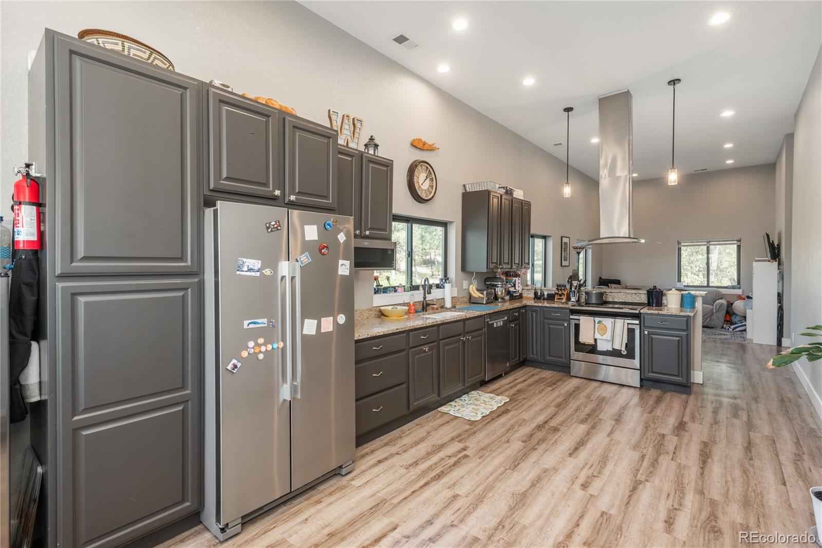 854 Russellville Road Franktown, CO 80116 - Photo 24 of 35 a kitchen with stainless steel appliances granite countertop a refrigerator and a stove