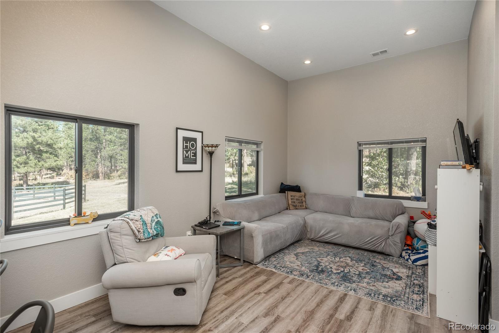 854 Russellville Road Franktown, CO 80116 - Photo 27 of 35 a living room with furniture and a window