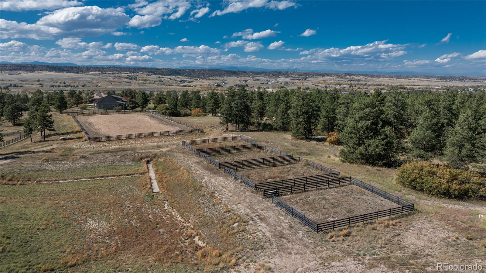 854 Russellville Road Franktown, CO 80116 - Photo 4 of 35 a view of a dry yard with wooden fence
