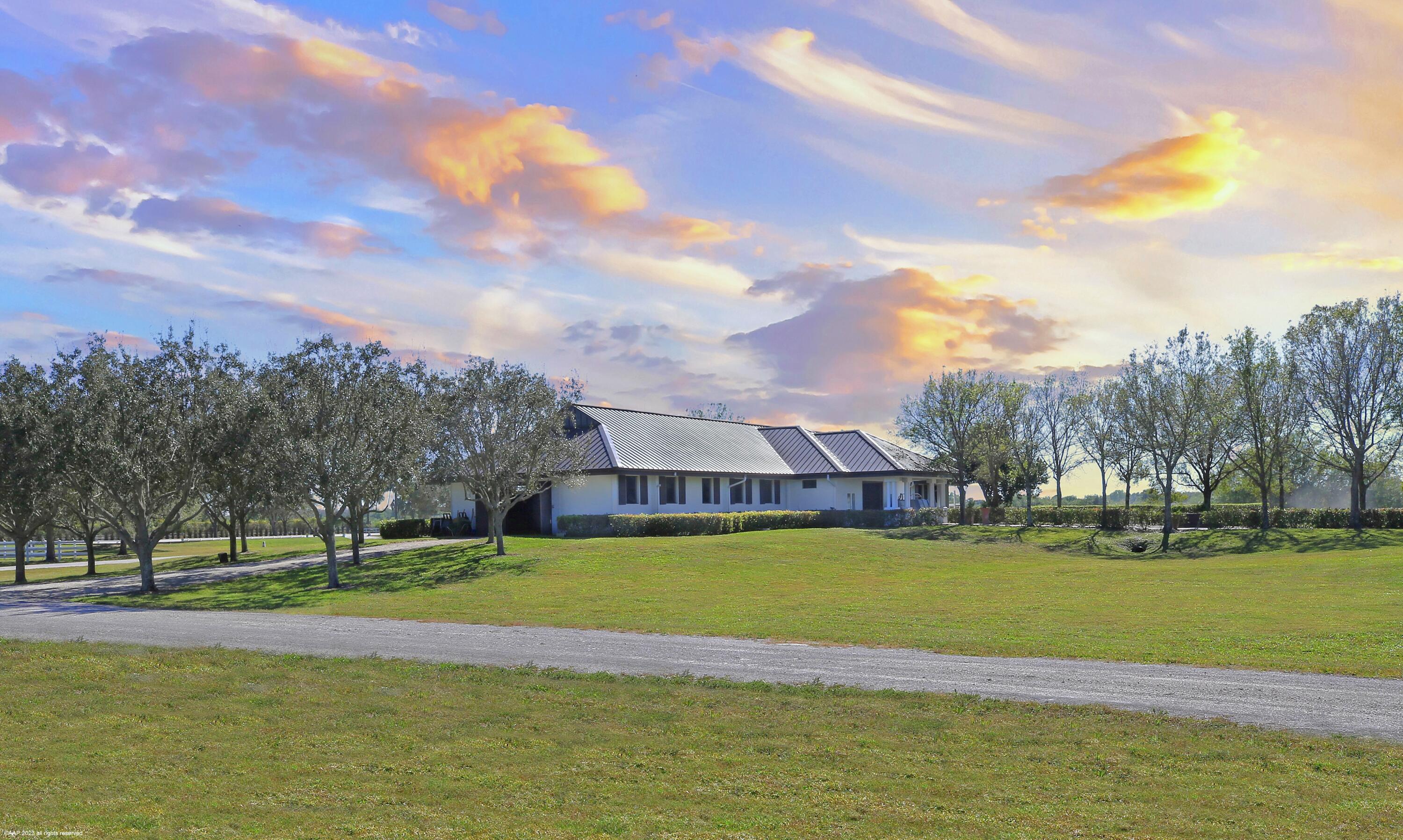 3790 Hanover Circle Loxahatchee, FL 33470 - Photo 13 of 73 a view of a swimming pool and a yard