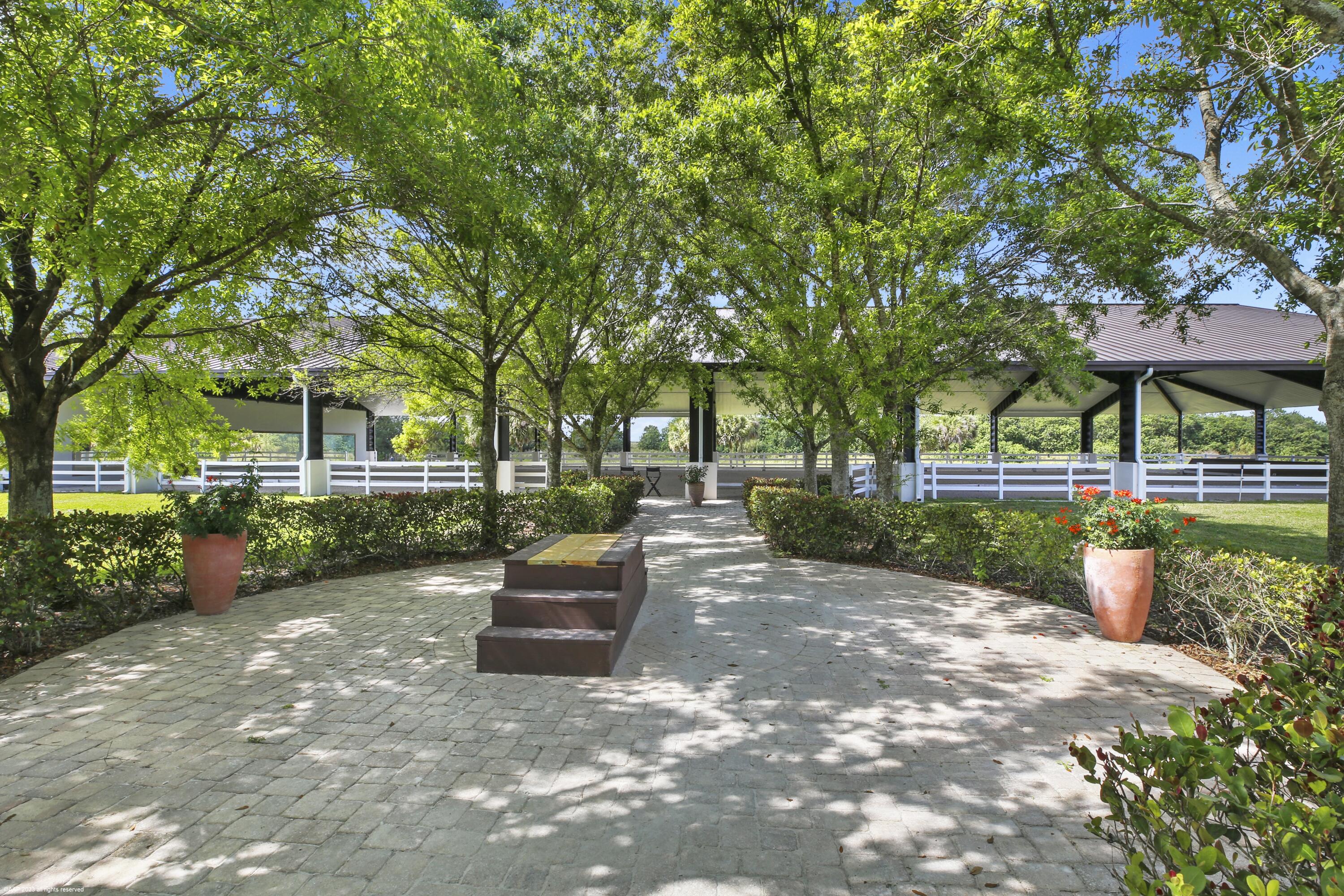 3790 Hanover Circle Loxahatchee, FL 33470 - Photo 26 of 73 a view of a swimming pool with a patio
