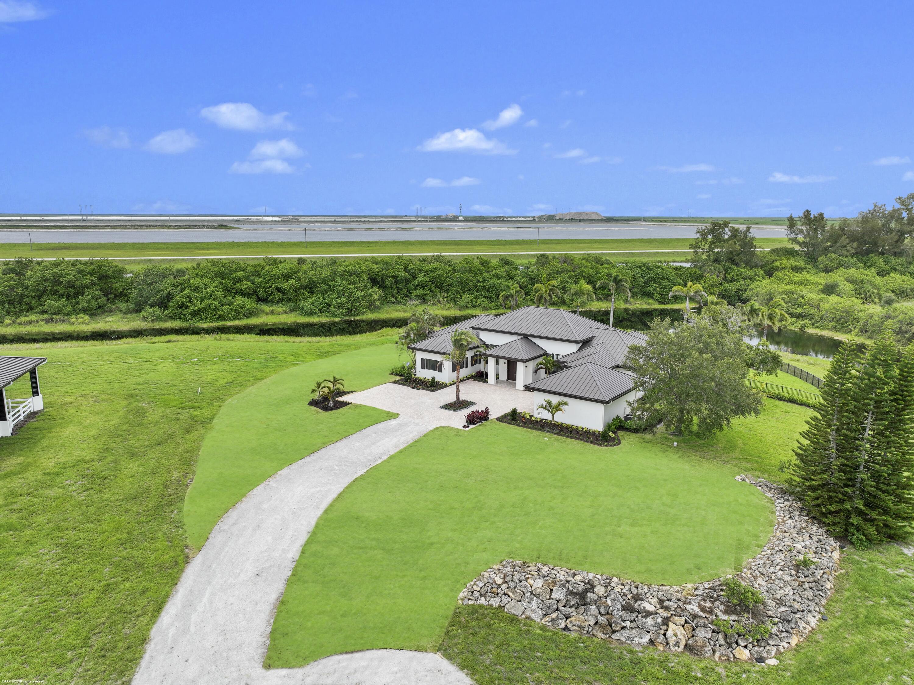 3790 Hanover Circle Loxahatchee, FL 33470 - Photo 3 of 73 a view of a garden and outdoor space