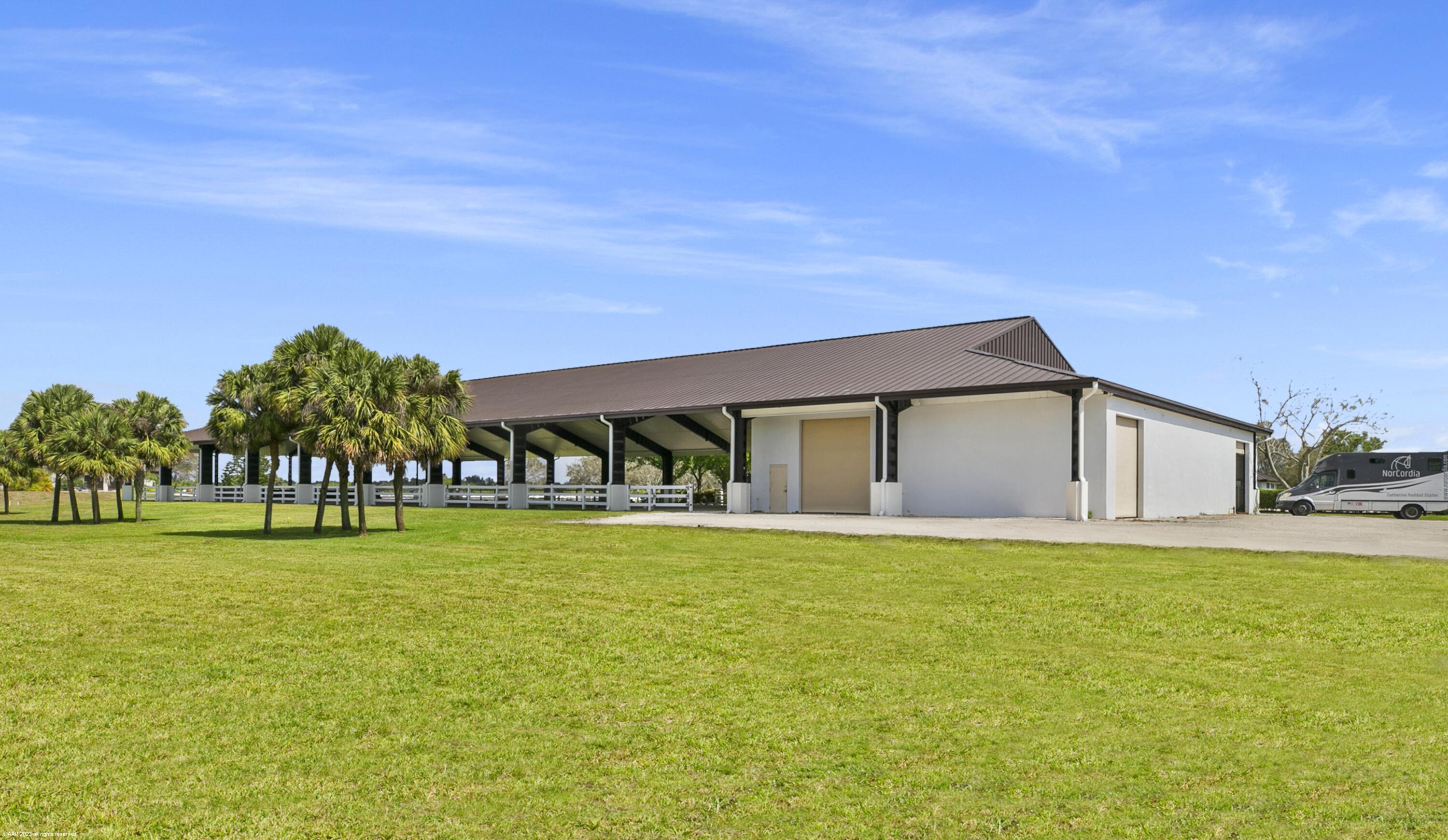 3790 Hanover Circle Loxahatchee, FL 33470 - Photo 35 of 73 a front view of a house with a yard