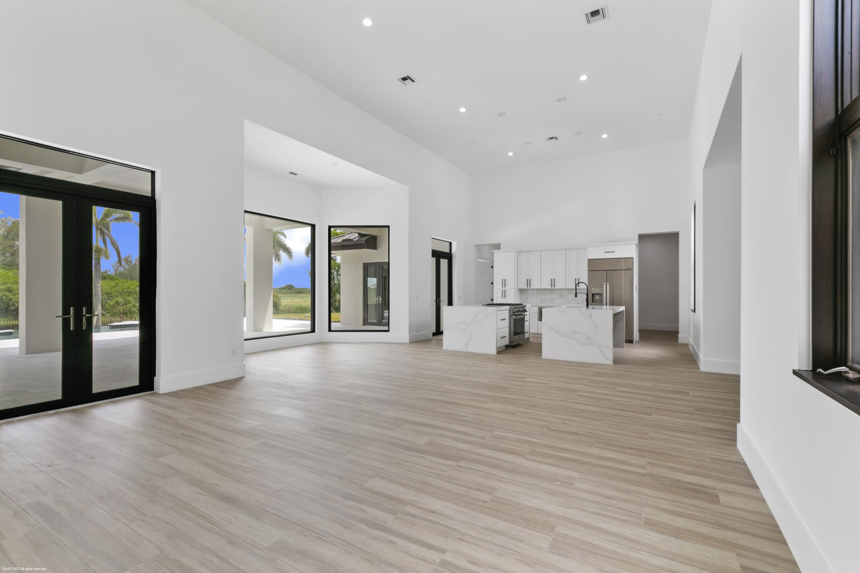 3790 Hanover Circle Loxahatchee, FL 33470 - Photo 46 of 73 a view of a kitchen with furniture and a flat screen tv