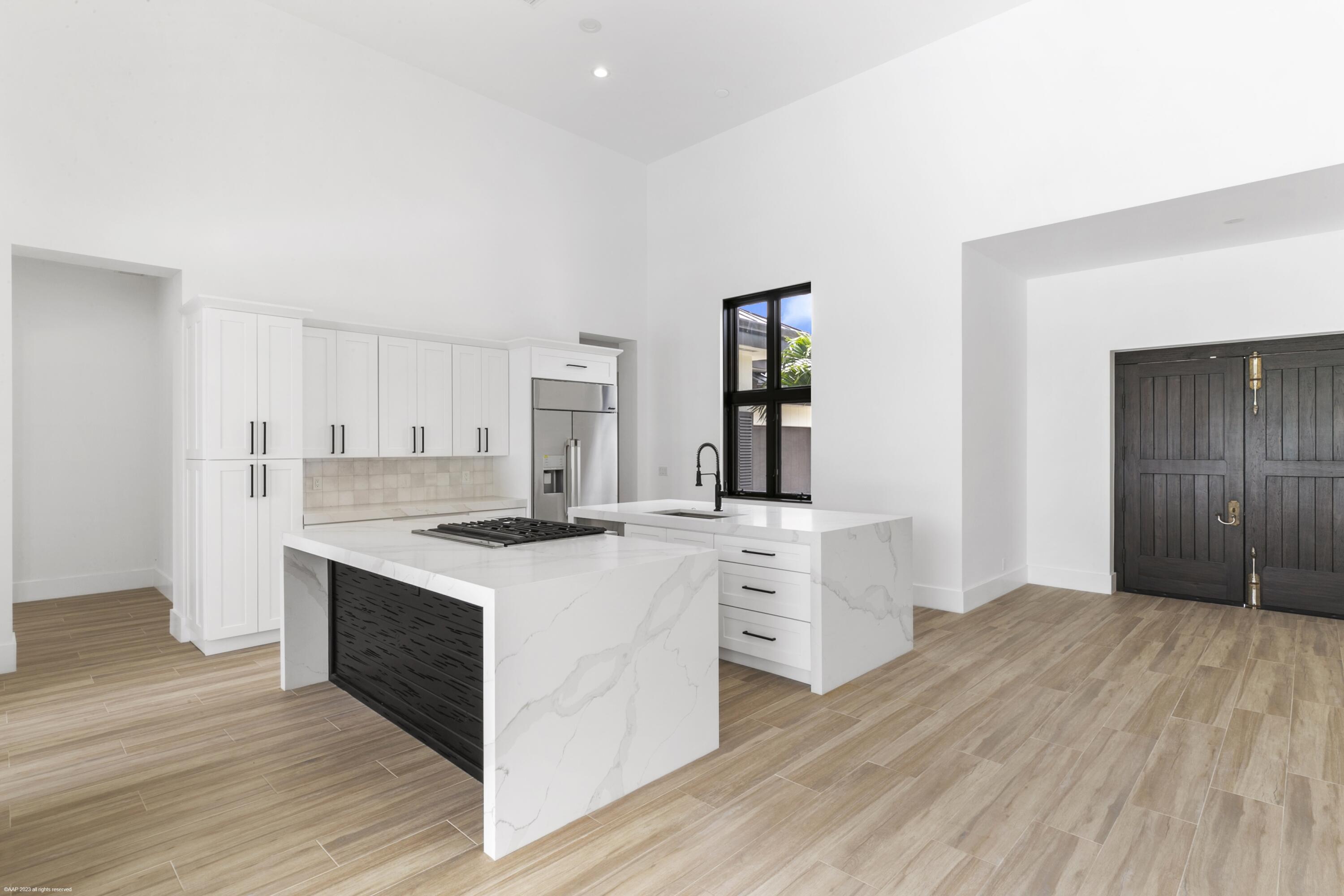 3790 Hanover Circle Loxahatchee, FL 33470 - Photo 5 of 73 a kitchen with stainless steel appliances granite countertop a stove and a sink