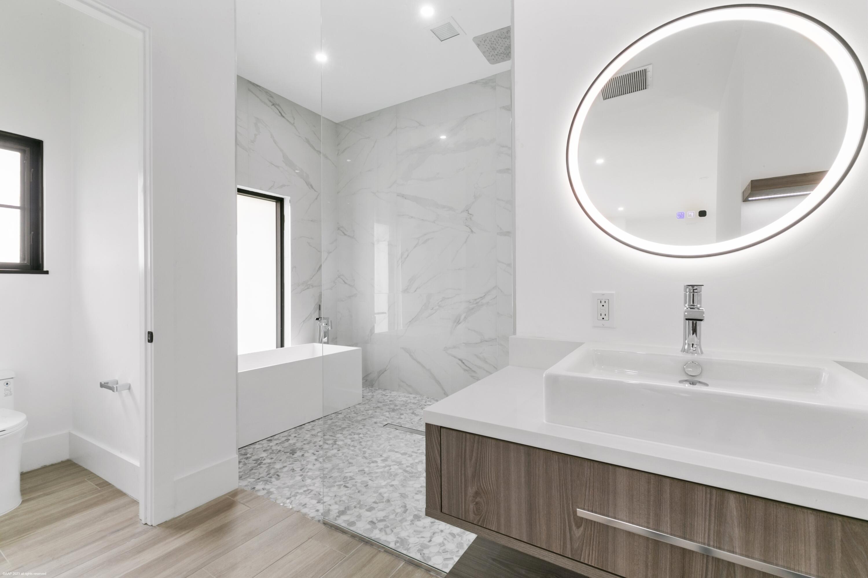 3790 Hanover Circle Loxahatchee, FL 33470 - Photo 55 of 73 a bathroom with a sink and a mirror