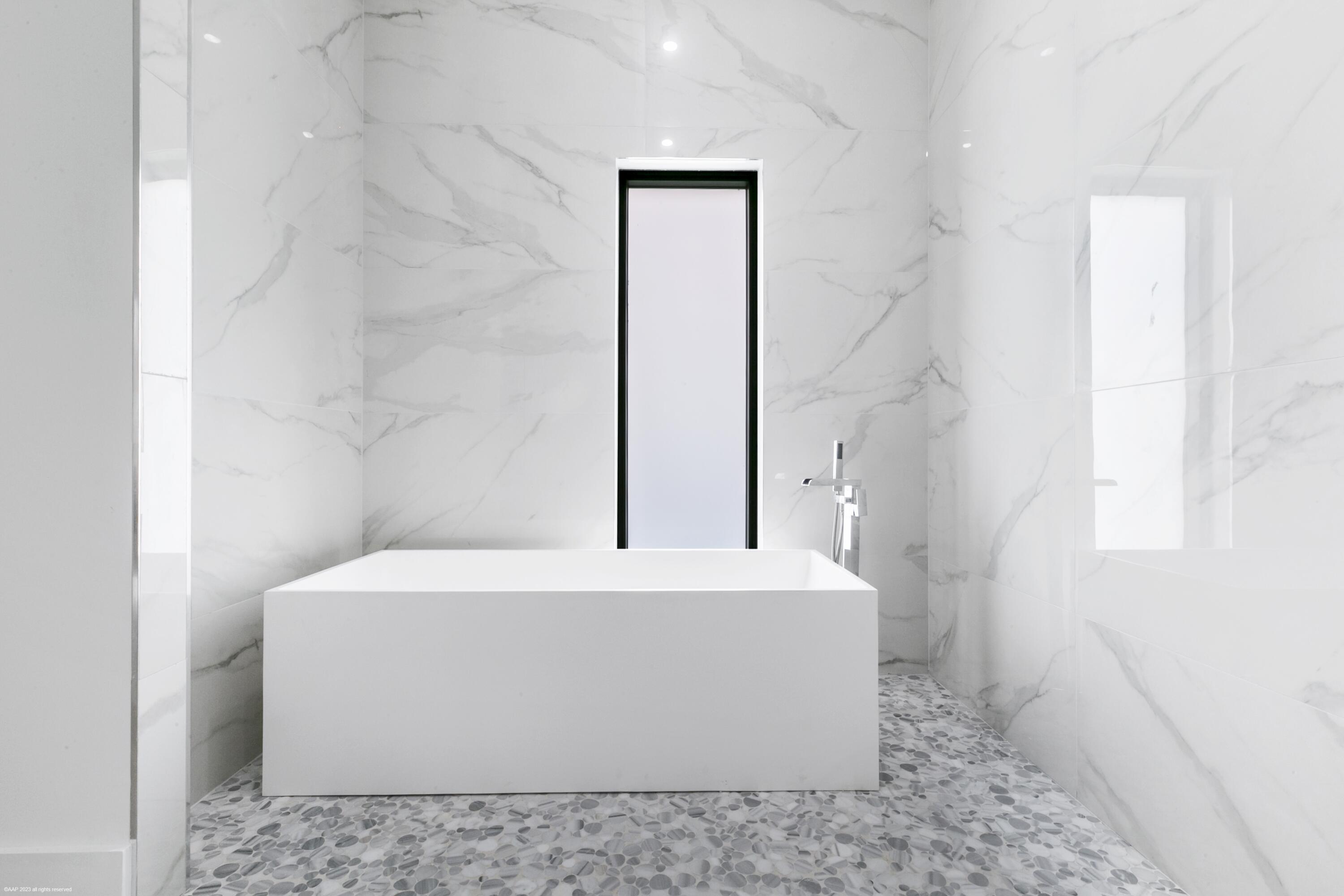 3790 Hanover Circle Loxahatchee, FL 33470 - Photo 61 of 73 a white bath tub sitting in a bathroom