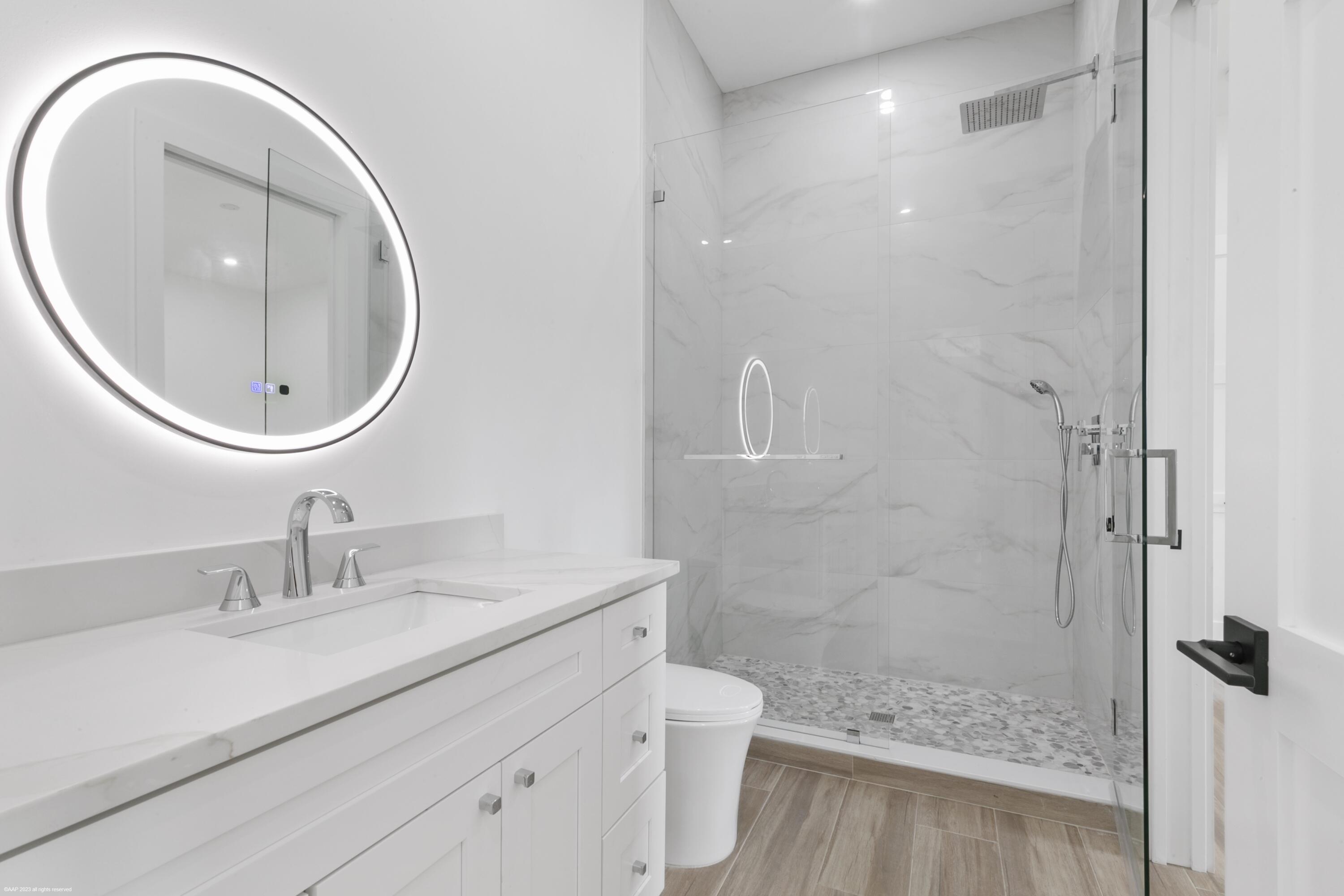 3790 Hanover Circle Loxahatchee, FL 33470 - Photo 66 of 73 a bathroom with a sink a toilet and a mirror