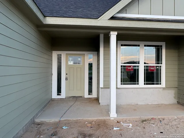 a spacious bedroom with a bed and a couch