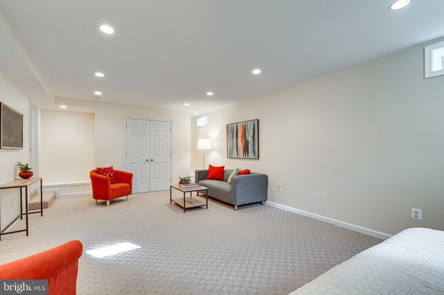 a view of a house with swimming pool and sitting area