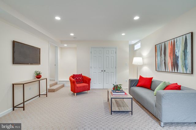 a house view with a sitting space and garden