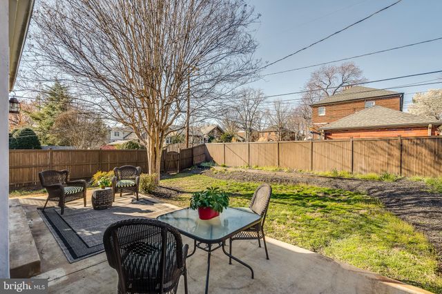 a living room with furniture and windows