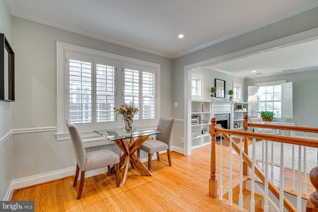 a kitchen with stainless steel appliances granite countertop a sink refrigerator and cabinets