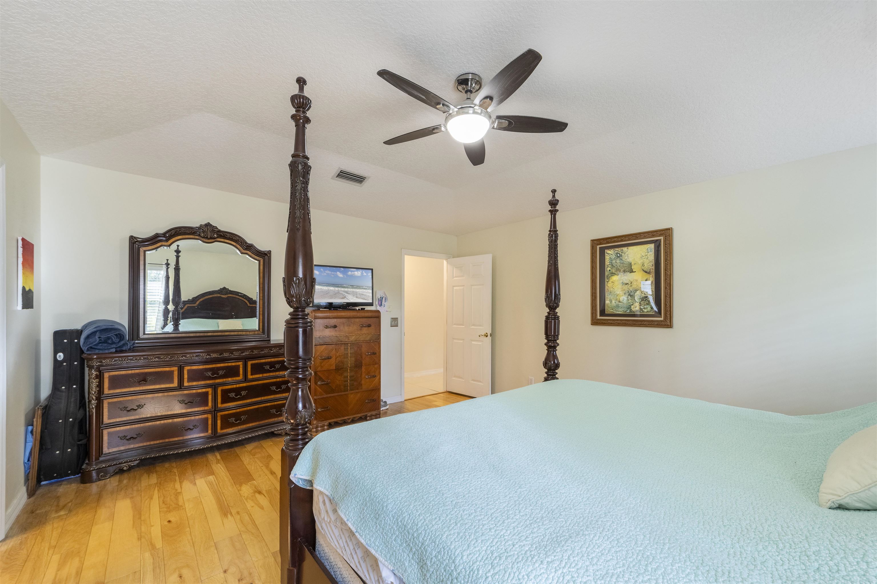 311 Graciela Circle St. Augustine, FL 32086 - Photo 35 of 65 Bedroom featuring light wood finished floors, ceiling fan, and a textured ceiling
