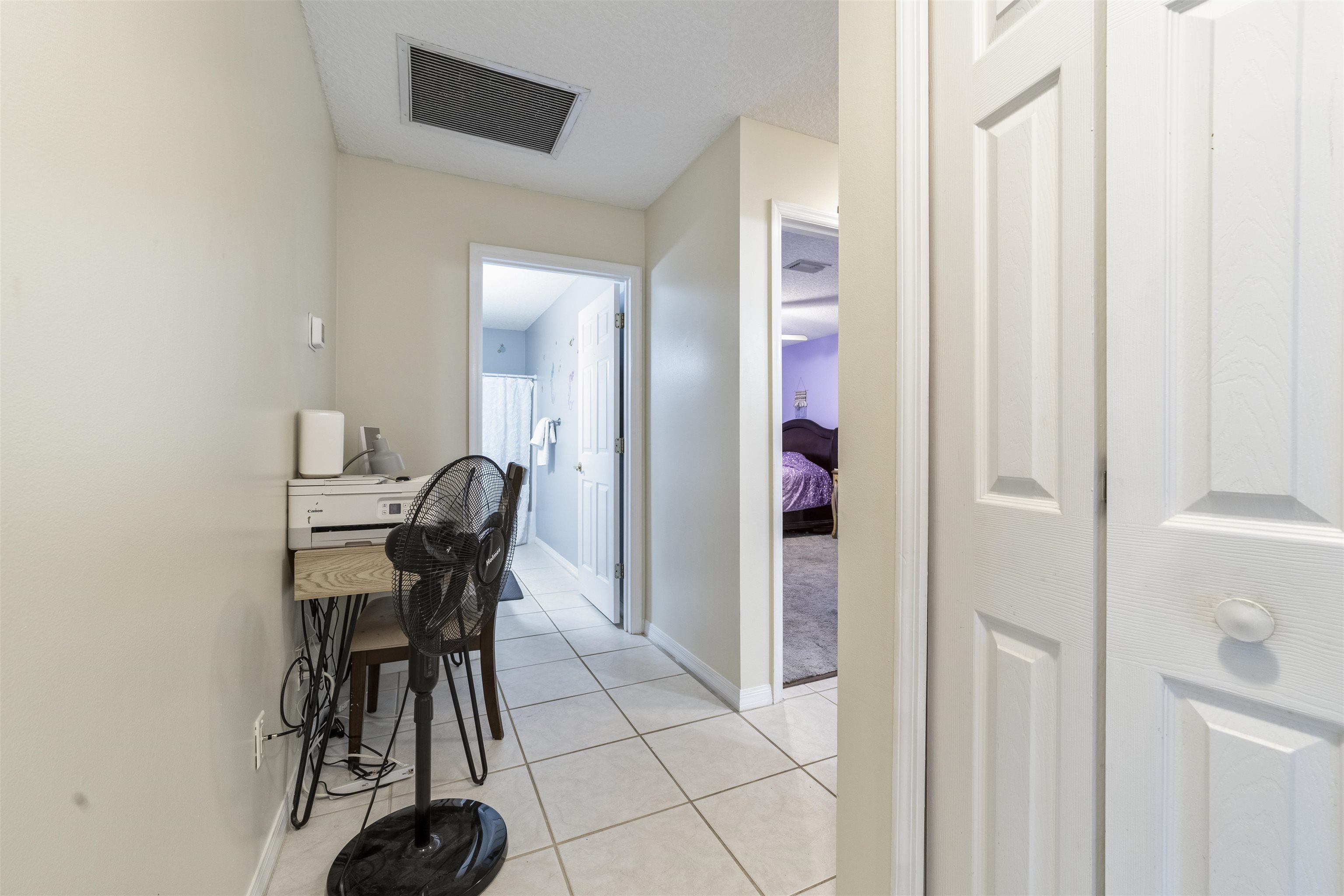 311 Graciela Circle St. Augustine, FL 32086 - Photo 44 of 65 Hallway with light tile patterned floors and baseboards