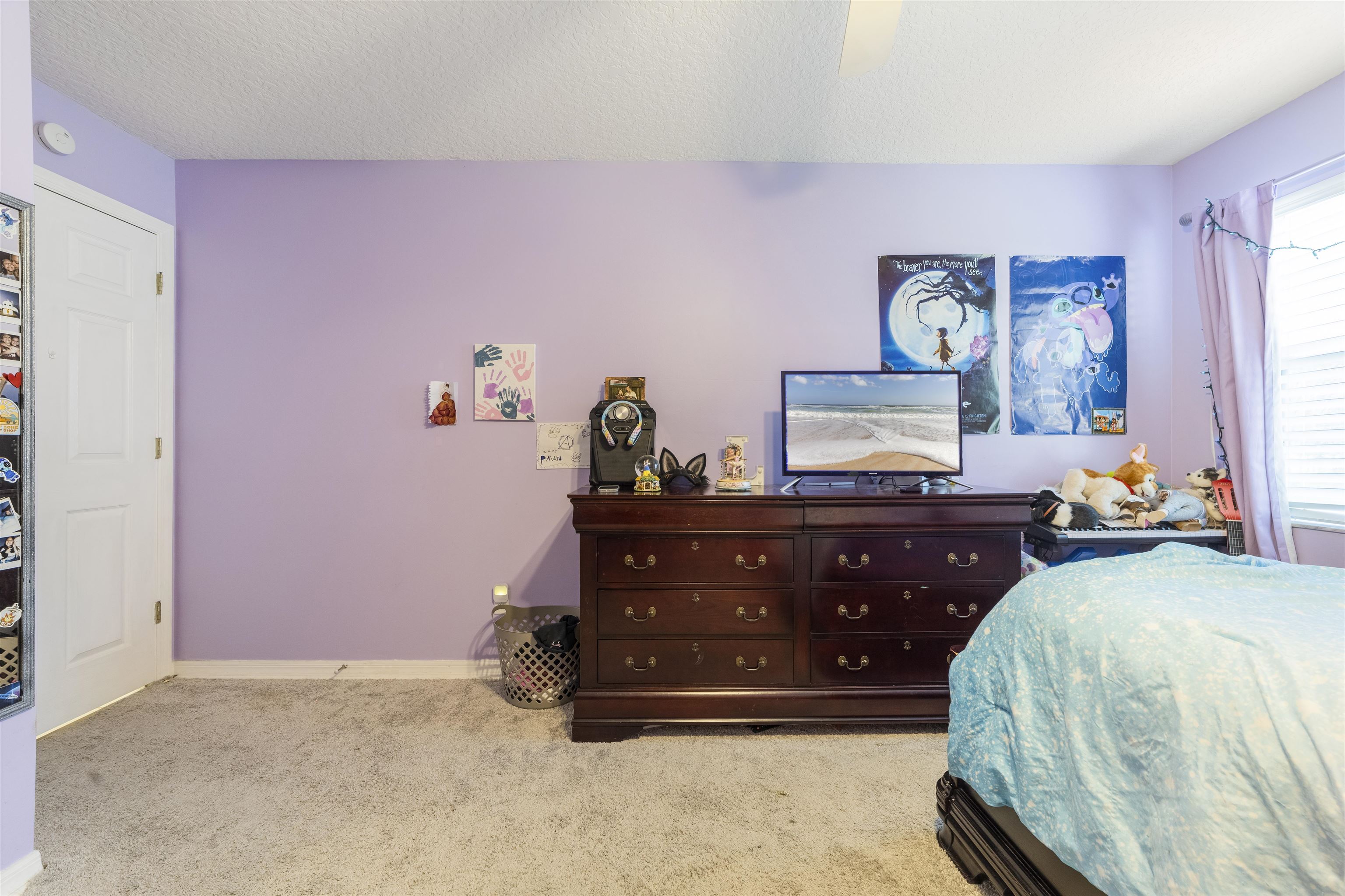 311 Graciela Circle St. Augustine, FL 32086 - Photo 47 of 65 Bedroom with light carpet, a textured ceiling, and a ceiling fan