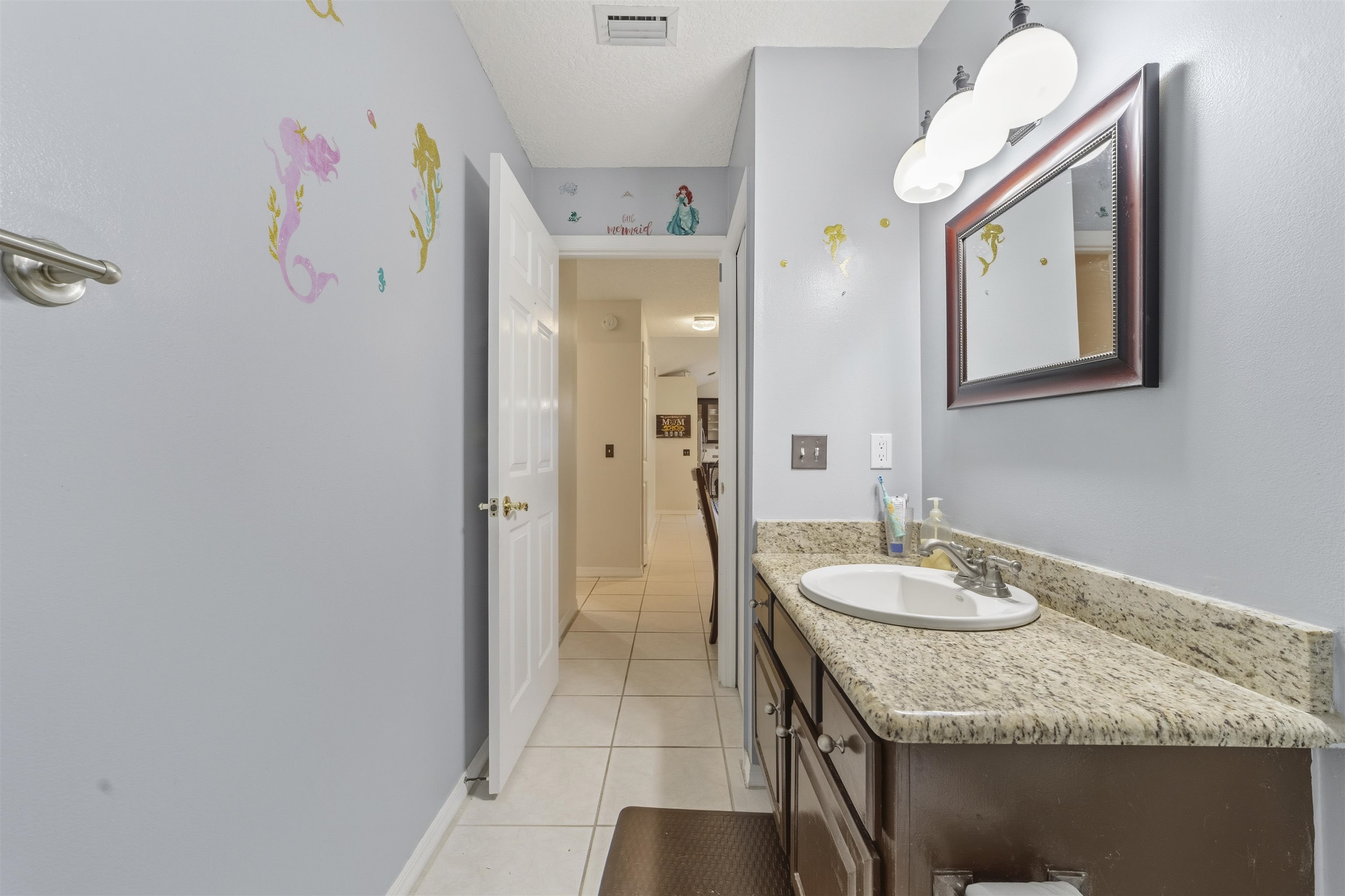 311 Graciela Circle St. Augustine, FL 32086 - Photo 48 of 65 Half bath with light tile patterned floors and vanity